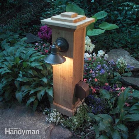 freestanding wooden box on pole outdoor electric light fixture|outdoor lighting and outlet.